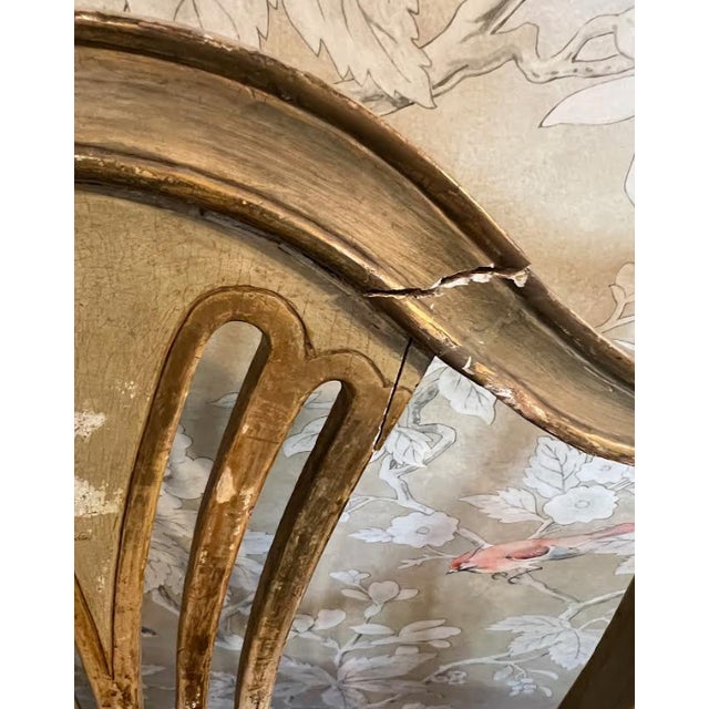 Elevate your interior with this stunning pair of Italian arm chairs, featuring the iconic "harp" or lyre-shaped backrest—a...