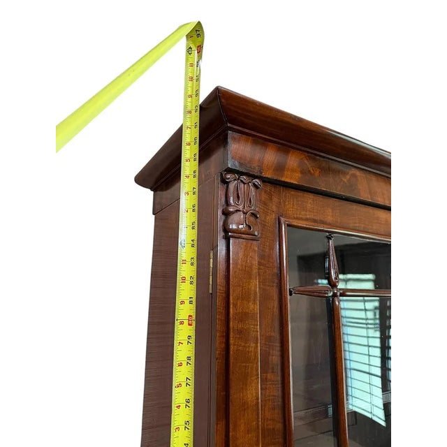 This Antique English Large Mahogany Secretaire Bookcase is a stunning piece of Victorian-era furniture, crafted from rich...