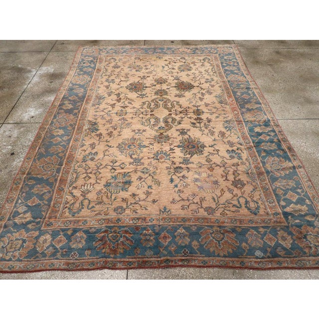 A vintage Turkish Oushak Room Size carpet handmade during the Mid-20th century. Measures: 8' 3" x 11' 3"