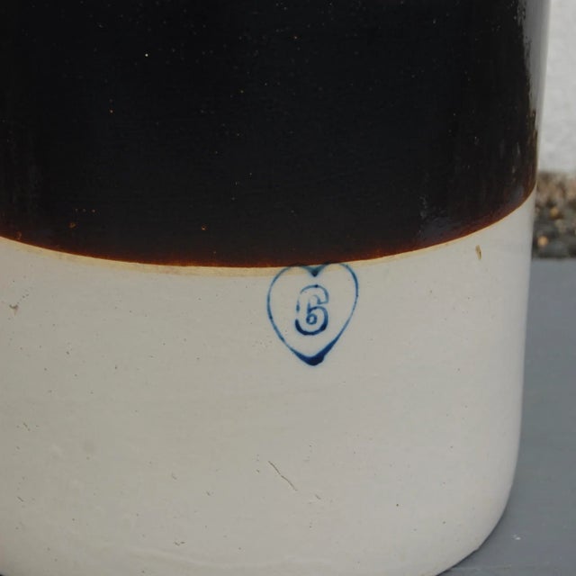 Practical and beautiful!. Medium sized antique stoneware crock in vintage condition - well used. Emblazoned with a heart...