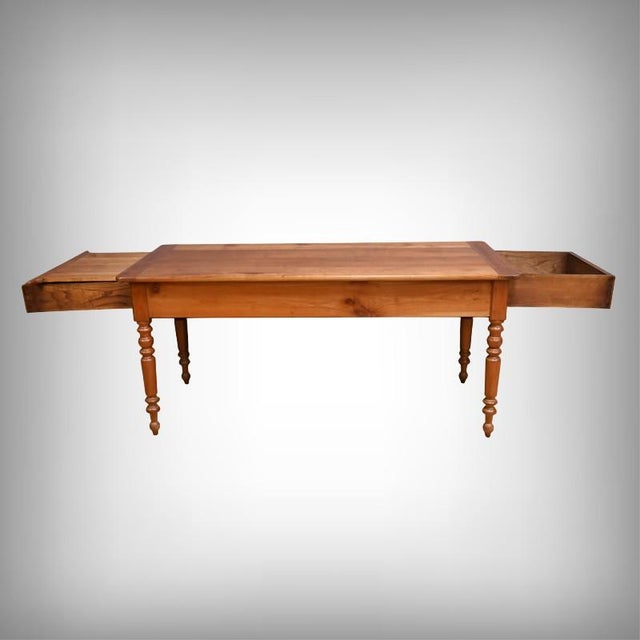 Charming cherrywood farmhouse table, dating from the late 19th century, boasting a beautiful, warm patina and a...