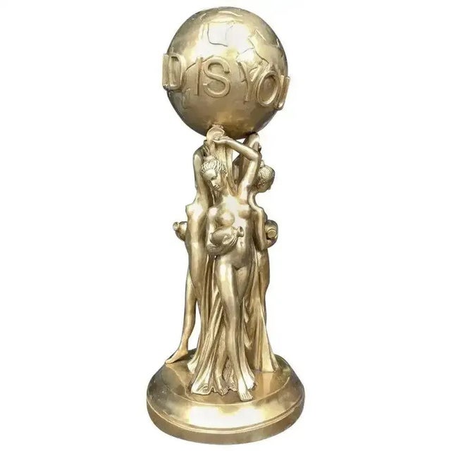 A stunning and unique bronze gold gild statue of 'the world is yours', 20th century. This piece is a replica of that seen...