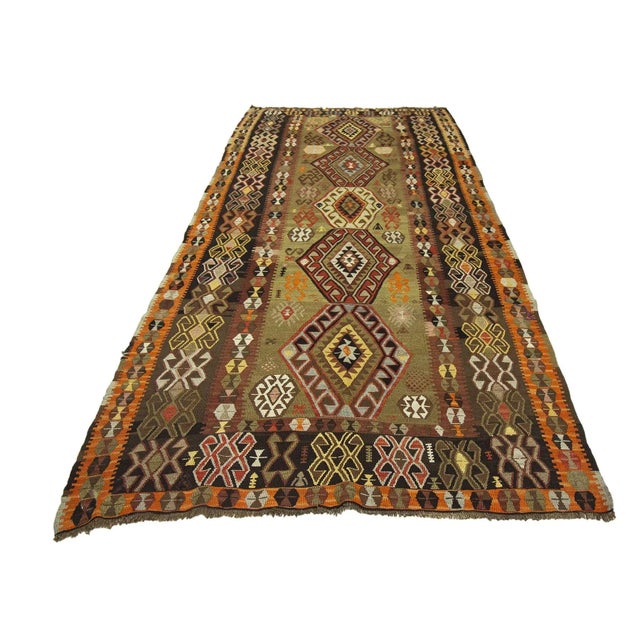 Vintage handwoven decorative kilim rug from Kars region of Turkey. Approximately 50-60 years old. In very good condition.