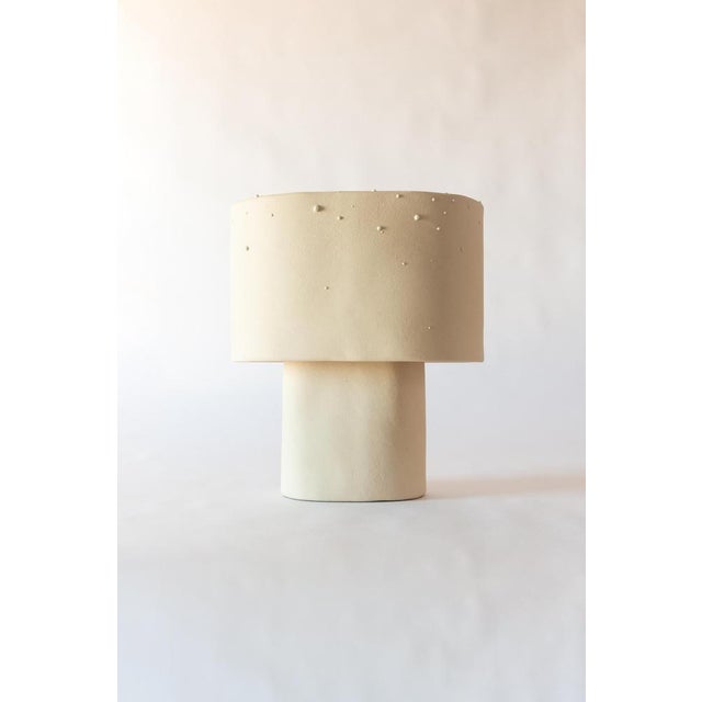 Beige medium table lamp in stoneware with drops effect glaze by lucas huillet unique piece dimensions: d 21 x w 38 x h 38...