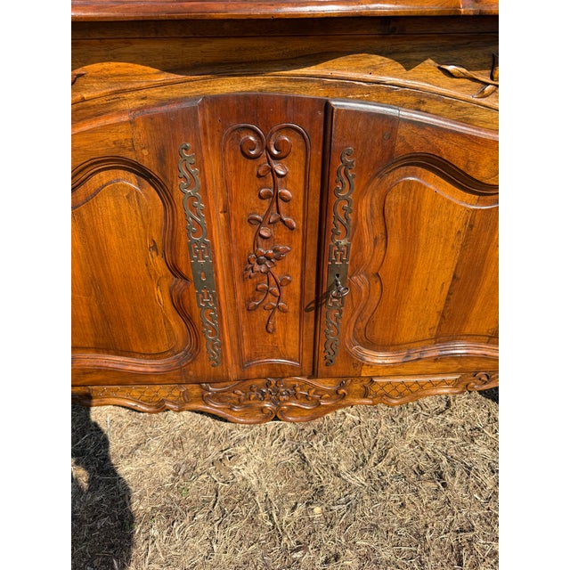 Fine 18th Century French Louis XV Provincial Solid Walnut sideboard made of solid walnut, the wood has been finished with...