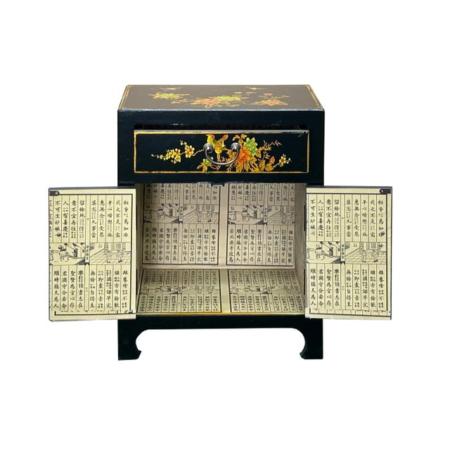 Step into a world of vibrant tradition with this stunning Chinese-style accent cabinet. Finished in a rich paint black,...