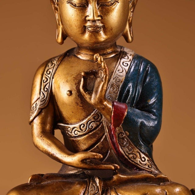 This captivating vintage sculpture depicts Shakyamuni Buddha seated in deep meditation upon a prominent, highly detailed...
