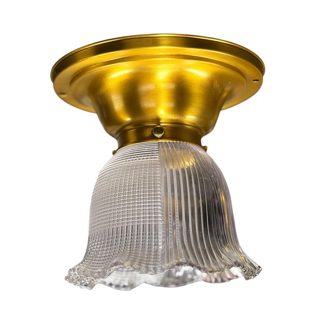 Lovely small light with pressed clear glass Holophane shade. The half and half design to scatter the light is rare. Light...