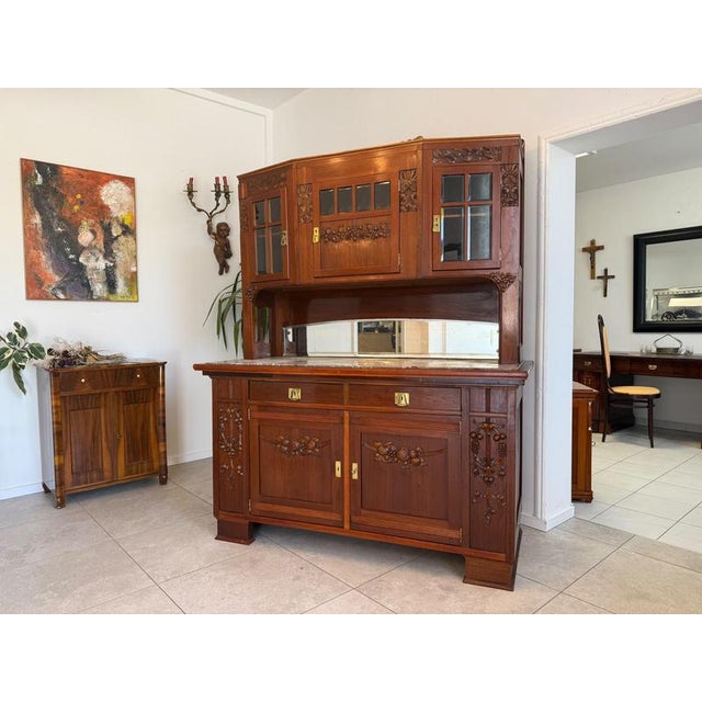Art Nouveau buffet with hutch, circa 1920. Dimensions (H × W × D at the outermost points): 209 × 160 × 70 cm. Oak veneer;...