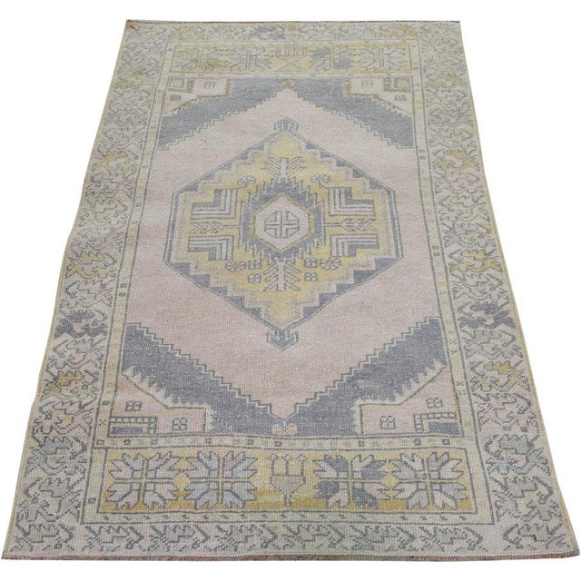 Hand-knotted with care using traditional rug-making techniques, this wool rug blends timeless craftsmanship with a modern...