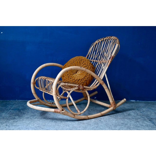 Made entirely of rattan and featuring flowing curves, this magnificent adult rocking chair is an ode to relaxation and...