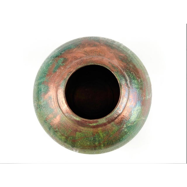 This is a classic example of a Japanese Raku-style pot. This pot is signed by "Perry" and exemplifies the level of skill...