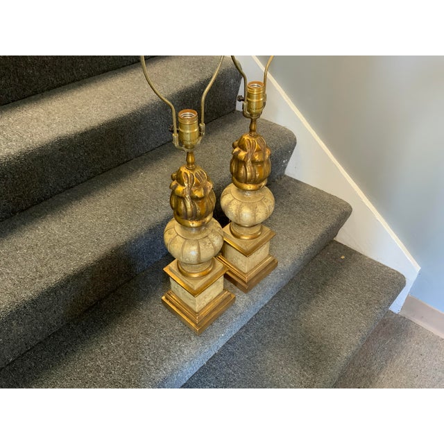 20th century pair of neoclassical style table lamps. Column and urn details. Base to top of socket measures 21.5 “