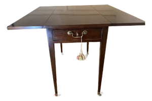 1990s The Kindel Drop-Leaf Mahogany Side Table Features a Drawer, Brass Caster Feet, and a Functioning Lock. With Two Leaves