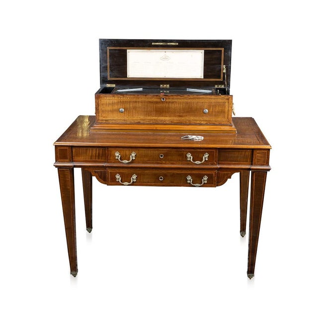 Antique 19th Century Swiss music box crafted in the form of a desk table. It comes with six interchangeable cylindrical...