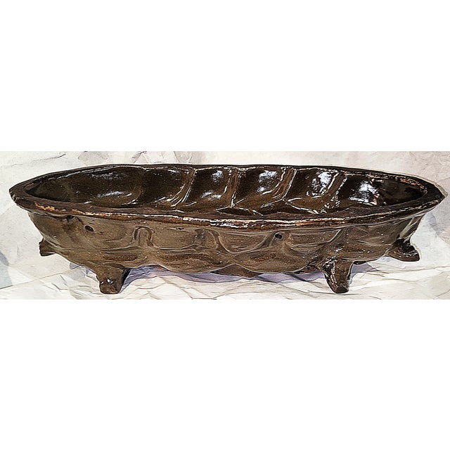 Tres' Francais, a glazed antique terracotta bead mold form (not as in moldy bread!), sits on 4 feet and had built in...