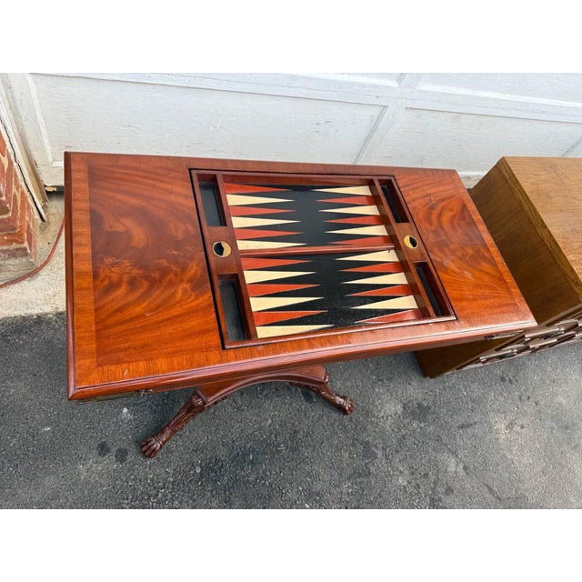 Vintage Emprire Style Flame Mahogany Inlaid Chessboard Top Game Table. The tabletop sliding open to reveal a single large...