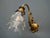 This luxurious wall lamp, made around 1900, is an elegant piece of lighting that will impress with its historical value...