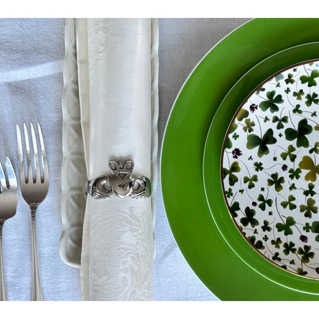 Originating in 17th-century Galway, the Claddagh is a traditional Irish symbol featuring two hands clasping a crowned...