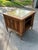 This is a mid-century modern side table. There is not a marking indicating who made it. It was likely made in the 1960s....