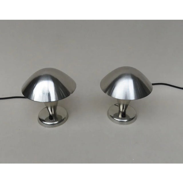 These two small table lamps were made and manufactured by NAPAKO in Prague in the 1930s/1940s. They are made from nickel-...
