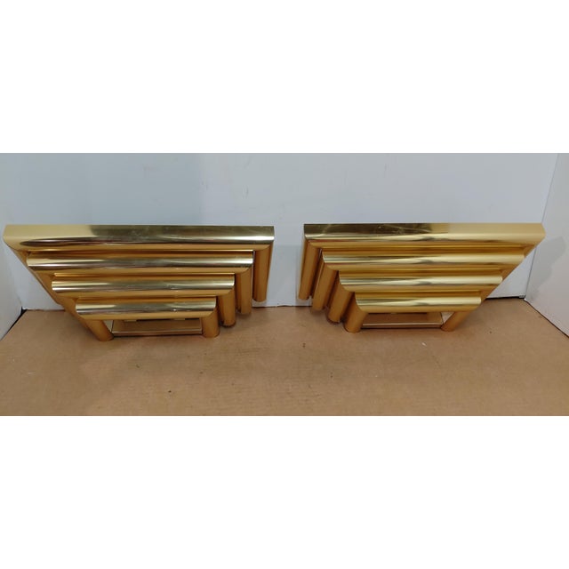 Pair of Custom Brass Art Deco Layered Wall Sconces. Measure 15" wide 7.5" deep 4.5" tall