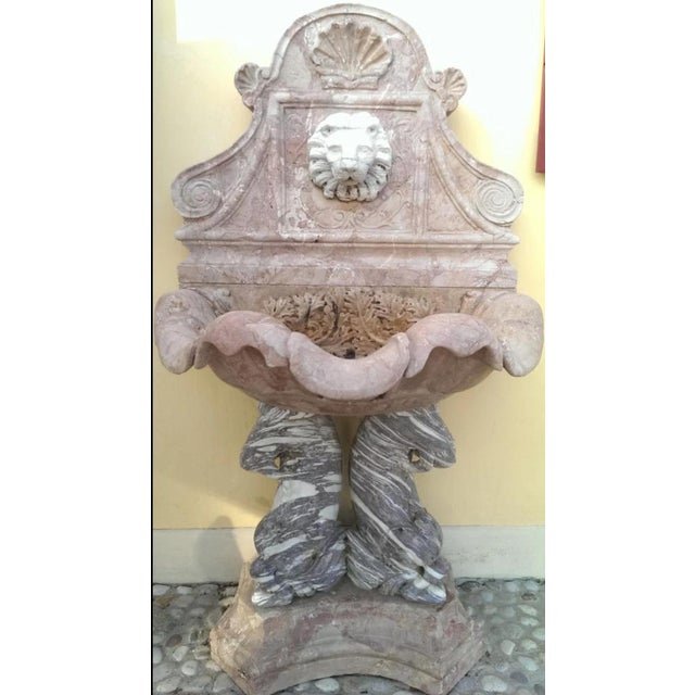 Spectacular wall fountain in Breccia Pernice and Giallo Siena marble. An extraordinary work of Venetian origin, composed...