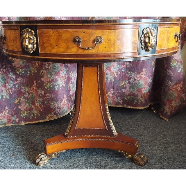 This beautiful 1920's Joseph Gerte signed mahogany and burlwood center table has carved claw feet and lions heads. It has...
