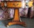 This beautiful 1920's Joseph Gerte signed mahogany and burlwood center table has carved claw feet and lions heads. It has...