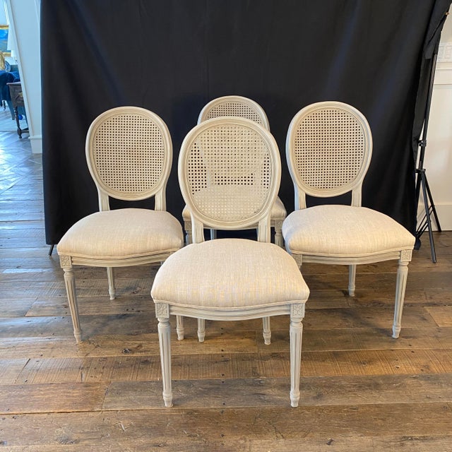 Beautiful subtle colors in this elegant set of four French Louis XVI style dining chairs or side chairs with new...