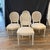 Beautiful subtle colors in this elegant set of four French Louis XVI style dining chairs or side chairs with new...