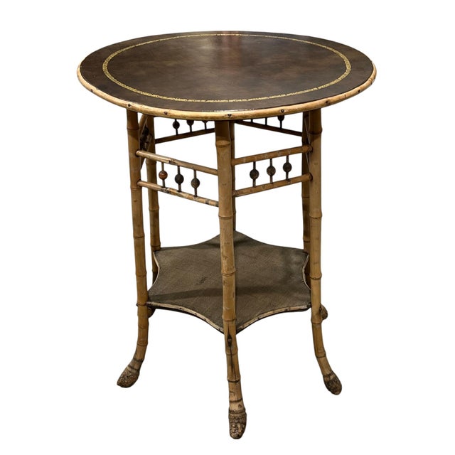 Aesthetic movement Japanoise accent table has bamboo legs. There are side braces with stick-and-ball detail and a shelf...
