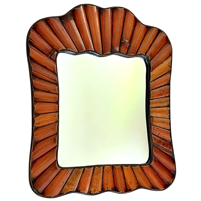 A striking vintage split bamboo wall mirror, circa 1970s, crafted in the style of Gabriella Crespi. Narrow strips of...