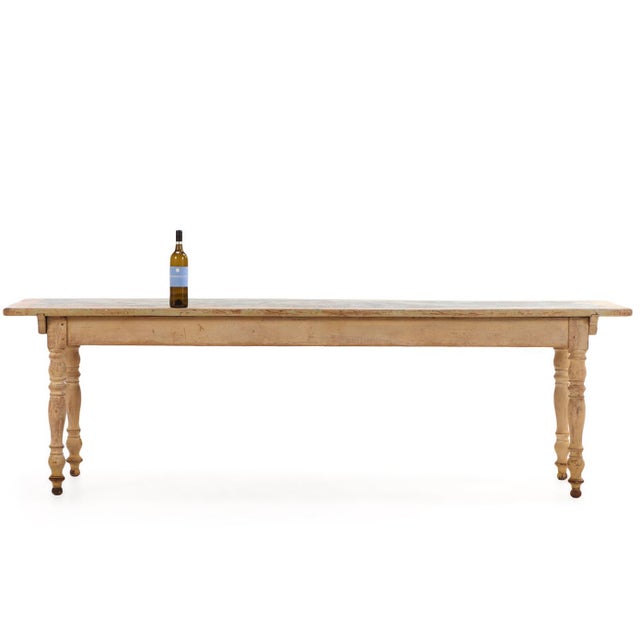 A rare 19th-century French painted pine farm table retaining its original painted surface and wonderfully aged patina. The...
