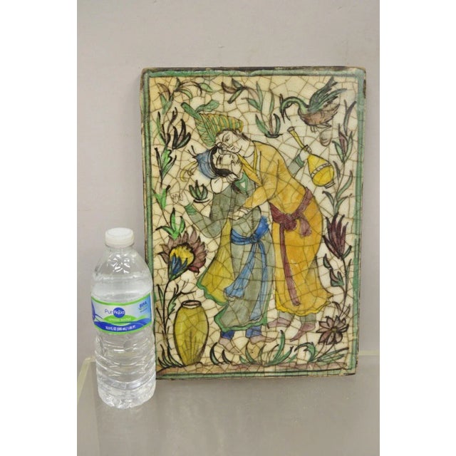 Antique Persian Iznik Qajar Style Ceramic Pottery Tile Green Man and Lady Embrace C2. Item features an original crackle...