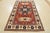 This traditional tribal geometric Caucasian Kazak rug is hand-knotted with an all-wool pile on a cotton foundation. This...