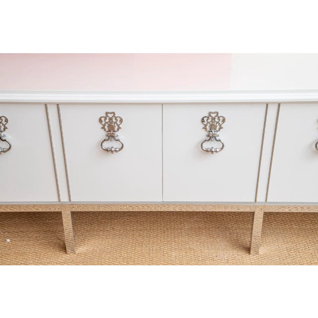 This absolutely stunning custom very long fully restored dramatic vintage Mastercraft cabinet has been newly white...