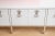 This absolutely stunning custom very long fully restored dramatic vintage Mastercraft cabinet has been newly white...