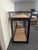 Dark wood and glass Asian display cabinet with an upper glass topped compartment and a lower two door cabinet. The upper...