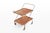 A charming vintage serving trolley designed by paul nagel for jie gantofta, combining warm wooden trays with a slender...