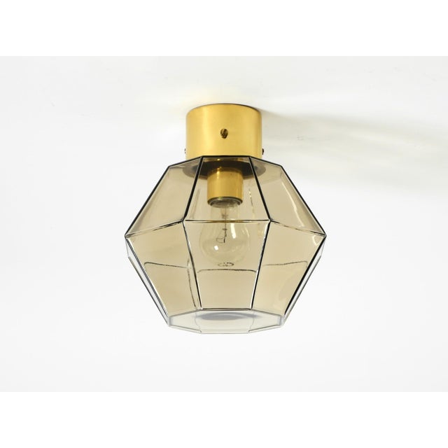 Beautiful original 1970s smoked glass ceiling lamp in an octagonal shape. the shade has a light brown tint. manufactured...