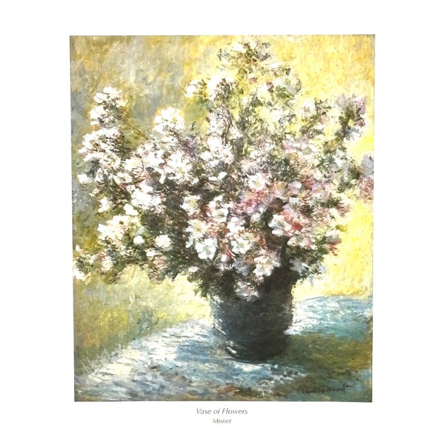 A vintage 1990s frames print named Vase of Flowers by Monet. Its hung in a gilded frame. Poster has the imprint 1998...