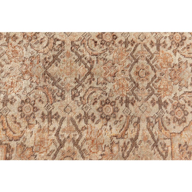 A late 19th century antique Persian Tabriz rug, the light brown field with a pale herati pattern around a central...