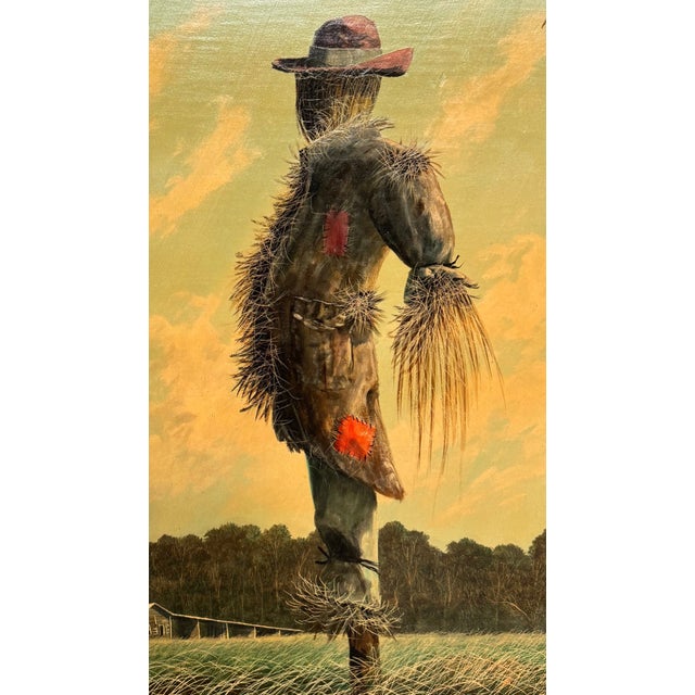 22”W x 28”H x 1 3/4”D Housed in a rustic, weathered barn-wood frame that mirrors its rural subject, Scarecrow in a...