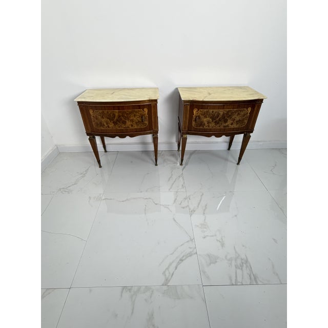 Set of two mid-century bedside tables with marble tops and brass accessories, 1950s Made in Italy, they are intact and in...