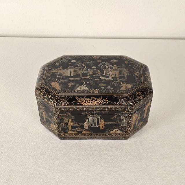 A 19th-century Chinese lacquered and gilt box. In good condition, with slight warp to top.