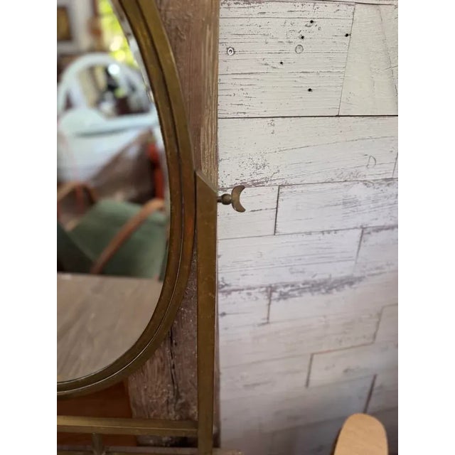 Elegant French Art Deco vanity table from the 1940s featuring a refined brass frame and classic lines. This bedroom...