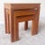 Excellent set of 3 hand carved cherry nesting tables. Each table features a centered Burl Wood veneer Large: 22”w, 14”d,...