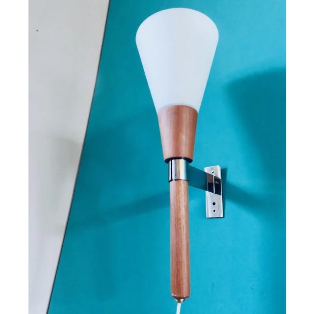 Swedish Wall Lamp in Teak and Opaline, 1960, in Flawless conditions. Designed 1960 to 1969 European Plug (up to 250V).The...