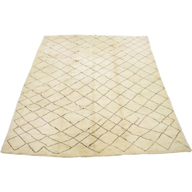 A stunning contemporary Moroccan-style wool rug, meticulously hand-knotted with a beige base and complemented by brown...